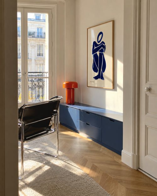 Blue figure #1 - Framed poster in an interior