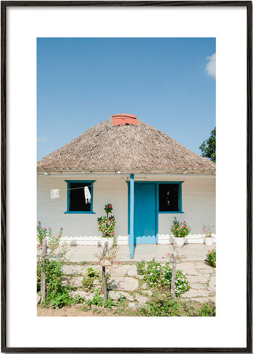 Quadro paesaggistico con casetta e porta blu
