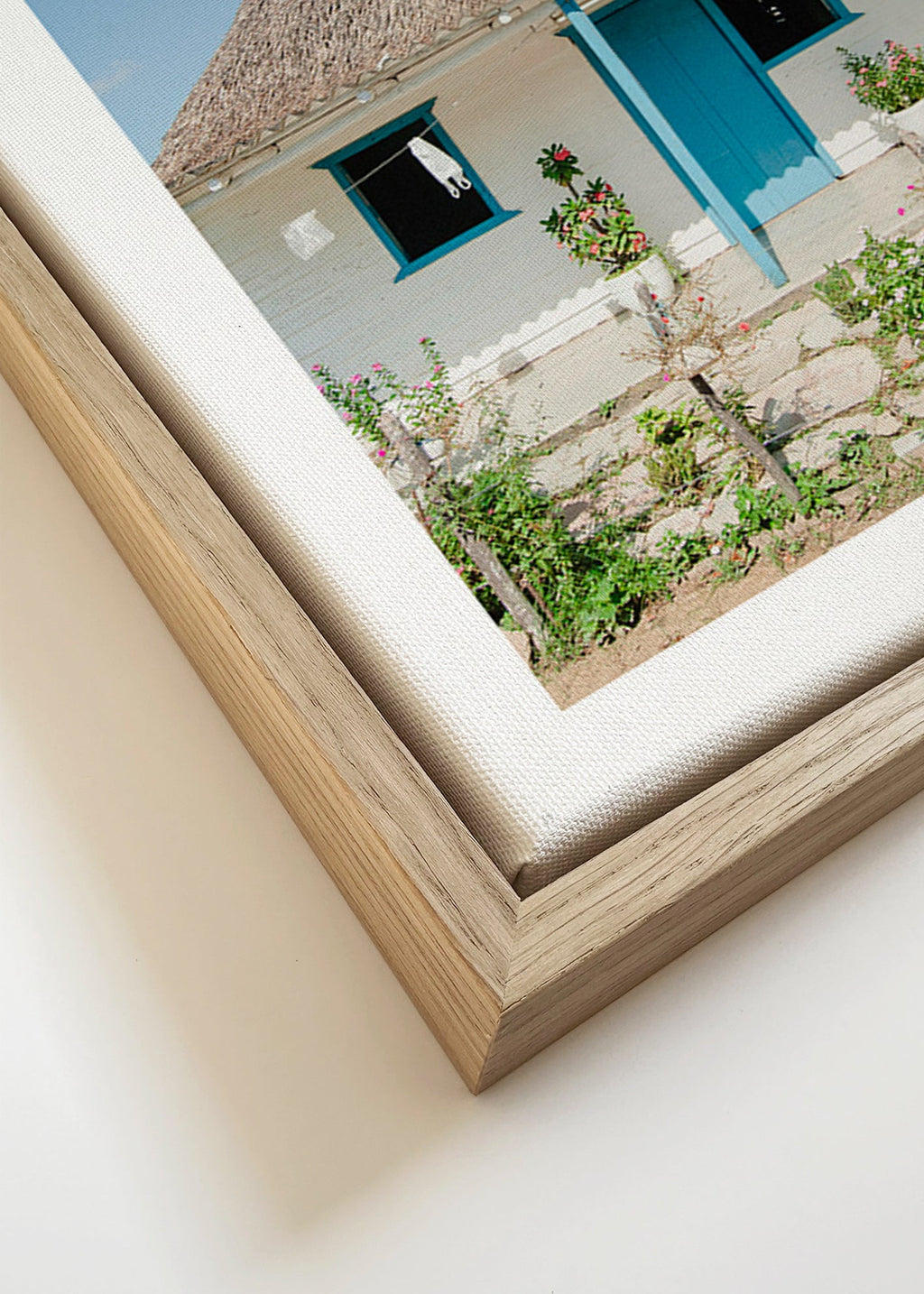 Quadro paesaggistico con casetta e porta blu