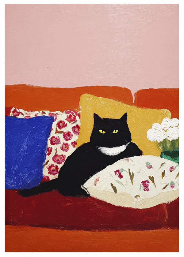 Opera gatto nero su divano colorato