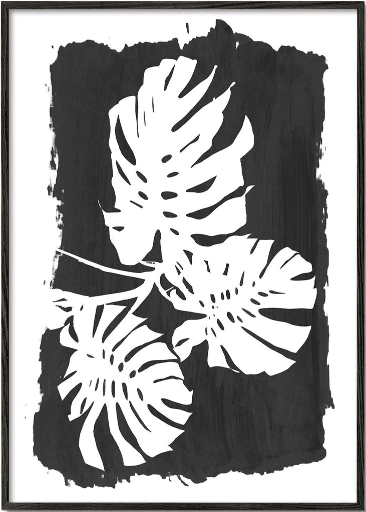 Monstera leaves on black paint