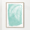 Palm leaves on mint green paint